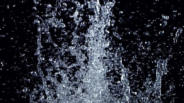 Super Slow Motion Shot Splashing Water Isolated on Black Background at 1000fps.