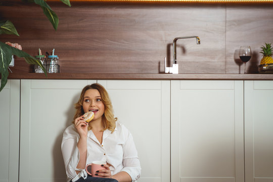 Charming Young Plump Woman Biting Sweet Donut