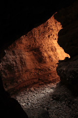 Fototapeta premium Mountain water stream pathway made a cave 