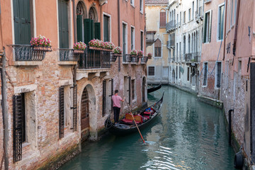 Fototapeta na wymiar Panoramic view of Venice canal with historical buildings and gondolas