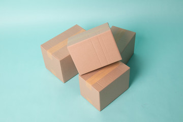 Pile of three  taped up  cardboard boxes