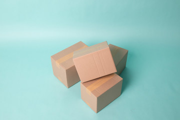 Pile of three  taped up  cardboard boxes