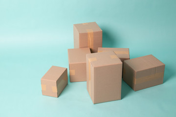 Pile of various size taped up  cardboard boxes