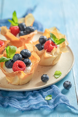 Homemade phyllo cups made of berry fruits and cream