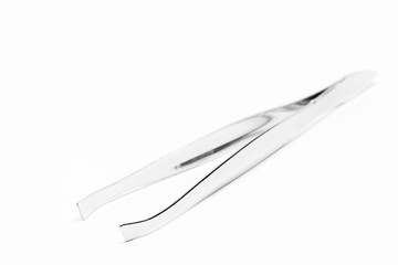 tweezers on white background