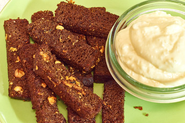 snack of bread toast with garlic, brown rye crouton with sauce