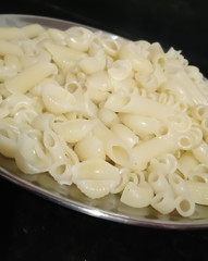 Uncooked Pasta as background.