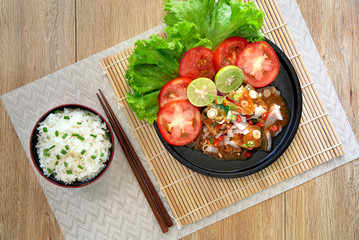 Spicy fish Canned Sardines Salad in black color dish and rice in black bowl (Thai food) but arrange dishes style Japanese