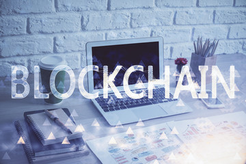 Double exposure of blockchain theme hologram and table with computer background. Concept of bitcoin...