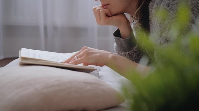 Young woman reading a book