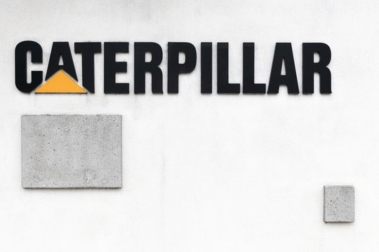 Grenoble, France - June 26, 2017: Caterpillar logo on a wall. Caterpillar is an American corporation which designs, develops, engineers, manufactures, markets and sells machinery, engines