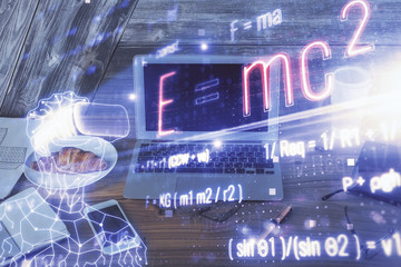 Desktop computer background and formula hologram writing. Double exposure. Education concept.