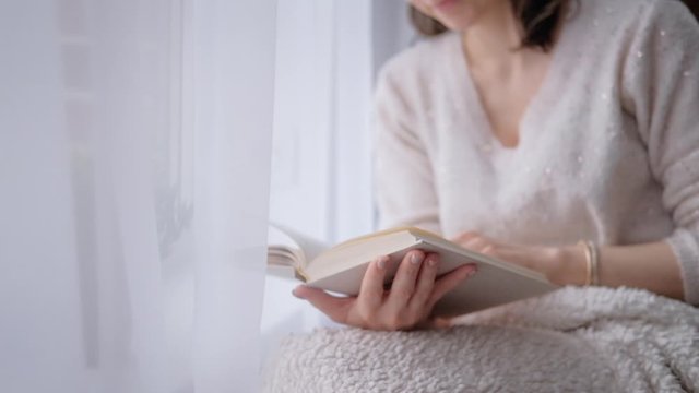 Young woman reading a book