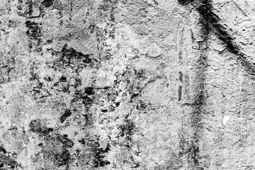 Texture of a concrete wall with cracks and scratches which can be used as a background