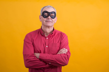 man with mask and arms crossed