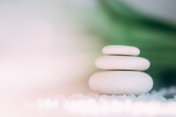 Spa still life with stacked of stone. Holiday, body care and luxury concept. 