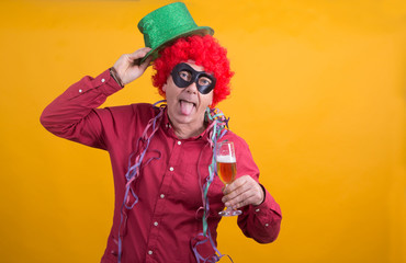 man with wig and streamers drinking fun, party concept