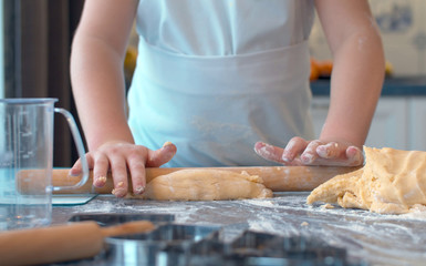 Girl rolling dough