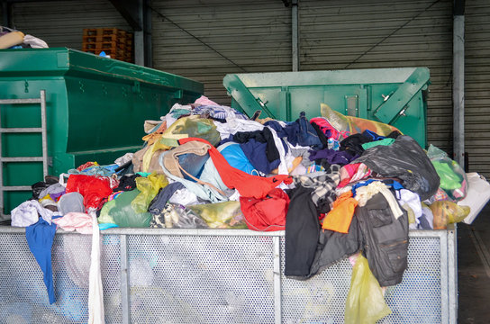 Used clothes at recycling utility. Circular economy concept.