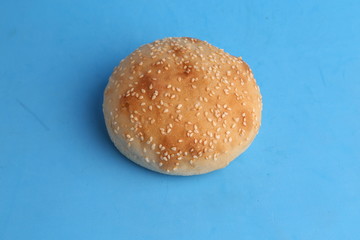 delicious bread rolls on colored background