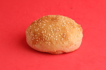 delicious bread rolls on colored background