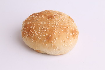 delicious bread rolls on colored background