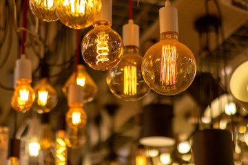 Various incandescent lamps in a store. Energy saving concept. - Powered by Adobe