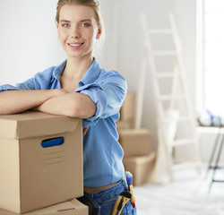 Portrait of a young woman with boxes