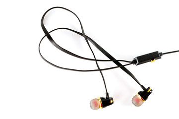 Vacuum headphones in black with a headset, shot on a white background. Background for music and communication.