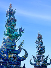 unique Blue Temple (Wat Rong Suea Ten). All the drawings and sculptures of all shades of blue. The blue statue of the temple guard.