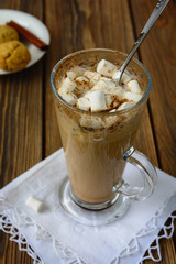 Homemade latte coffee with cinnamon and marshmallows