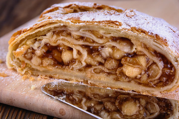 Delicious strudel stuffed with apples and cinnamon, close up