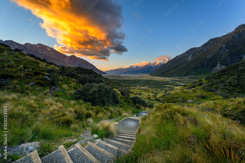 Sticker Stairway uphill to see Lake Tasman with stunning views of the mountains and the morning sky and stunning clouds in Mount Cook National Park, Aoraki, New Zealand.