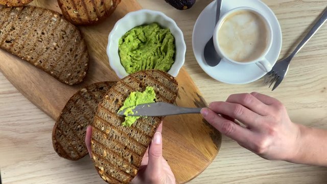 Top View Of Healthy Breakfast With Avocado Toast And Coffee In Cafe. 