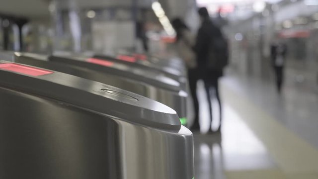 Validator. Checkpoint. Red blinking lights. Ticket control. The entrance and exit to the subway. 