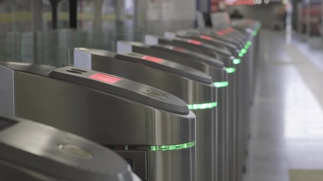 Validator. Checkpoint. Red blinking lights. Ticket control. The entrance and exit to the subway. 