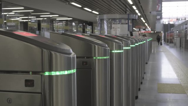 Validator. Checkpoint. Red blinking lights. Ticket control. The entrance and exit to the subway. 