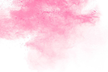 Pink powder explosion on white background.Pink dust splashing.