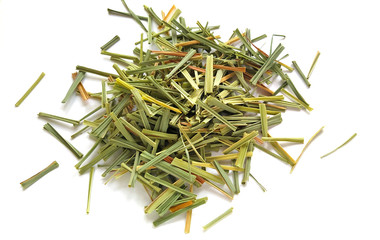 Lemon Grass (Cymbopogon citratus, Capim Limao, Santo). Pile of dried Lemongrass. Dried sprigs of natural lemongrass, dried herb, herbal medicine. Selective focus, closeup