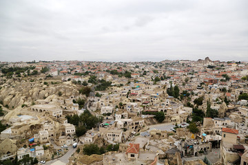 Fototapeta na wymiar Ortahisar, Turkey - 09.16.2019: View of the city from a fortress carved into the monolithic rock of Sivrikai.