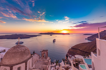 Amazing evening view of Santorini island. Picturesque spring sunset on the famous Greek resort Fira, Greece, Europe. Traveling concept background. Artistic style post processed photo. Summer vacation