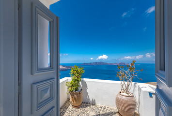 Beautiful view of picturesque town in Santorini, caldera and volcano on the Mediterranean Sea. Traditional white architecture, holiday island of luxury summer vacation destination in Greece © icemanphotos