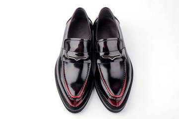A pair of wine red leather shoes