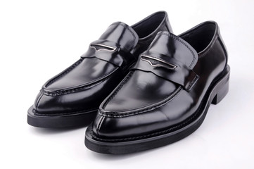 A pair of black men's leather shoes on white
