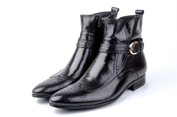 A pair of black men's leather shoes on white