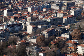 Fototapeta na wymiar Bulgaria cityscape, top view on tiled roofs of houses