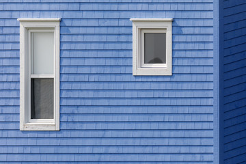 White windows on blue tiled wall