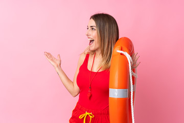 Lifeguard woman over isolated background with surprise facial expression