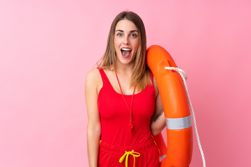 Lifeguard woman over isolated background with surprise facial expression