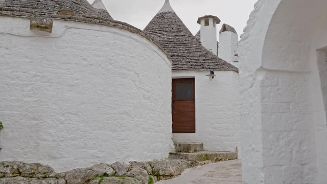 Walking streets of trulli town Alberobello, Italy